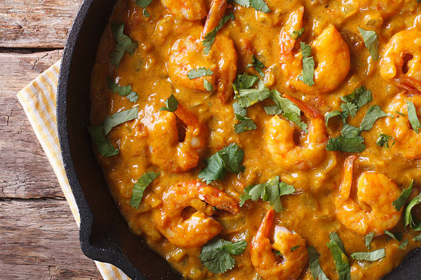 istock Prawns in curry sauce close-up. horizontal view from above 479591036