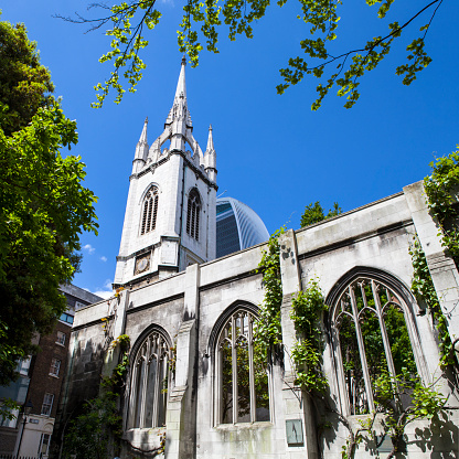 The ruins of the historic St. Dunstan-in-the-East church in the City of London.  The church was destroyed during enemy action in 1941 and has since been turned into a public garden.  The Walkie Talkie skyscraper (20 Fenchurch Street) can be seen in the background.