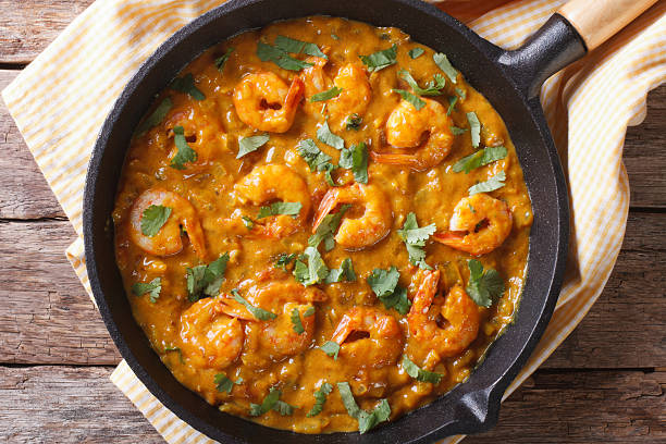 istock Shrimp in curry sauce in pan close-up horizontal top view 479594226