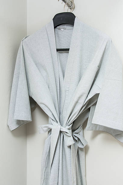 istock gray bathrobe hanging in the closet 479598544