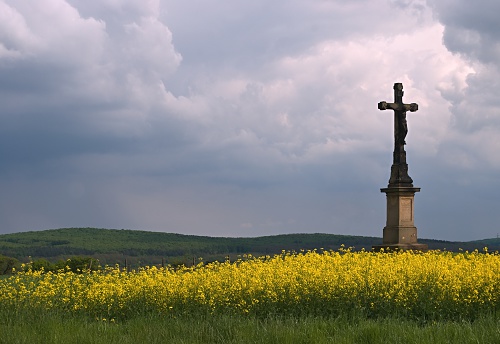 Ancient stone cross on a hill near the village of Malo Malovo, Dragoman Municipality, Sofia Province, Western Bulgaria on a sunny summer day