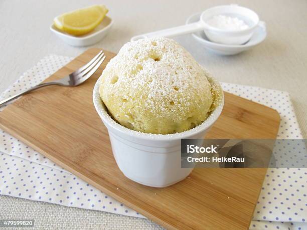Lemons Mug Cake With Powdered Sugar Stock Photo - Download Image Now - Microwave, Cupcake, Sweet Pie