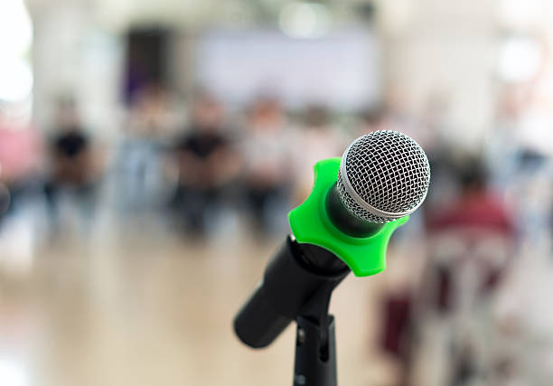 istock Close up of microphone in conference room on blurred background 479600204
