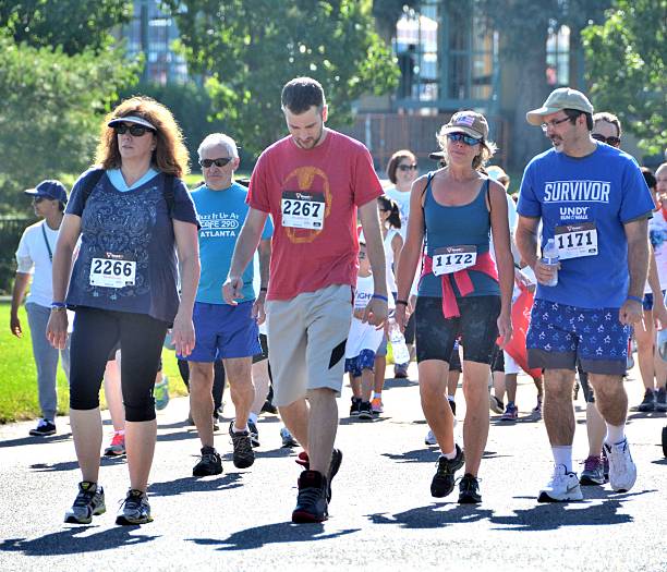 Walkers Denver, CO, USA - June 27, 2015: 2015 Denver Colon Cancer Undy Run/Walk! walking for a cause stock pictures, royalty-free photos & images