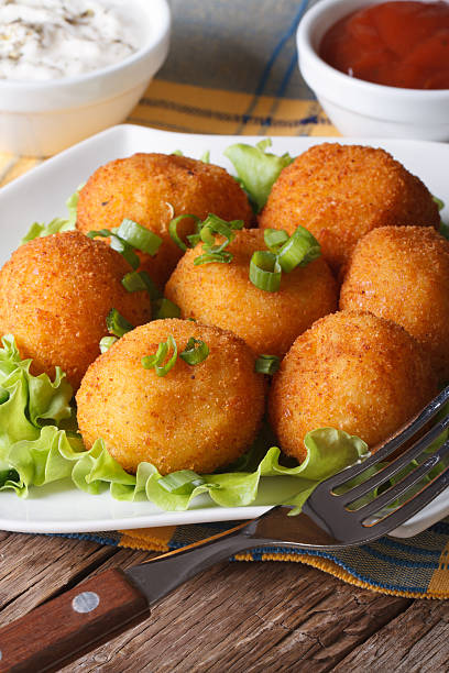 istock potato croquettes on a white plate close-up. vertical 479602964