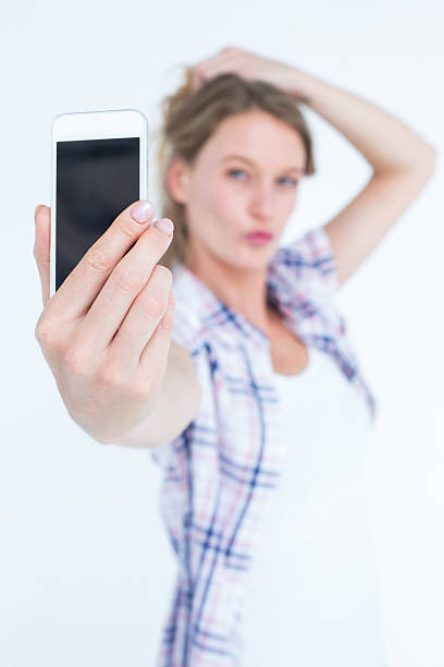 istock Pretty hipster taking selfie with smartphone 479603722