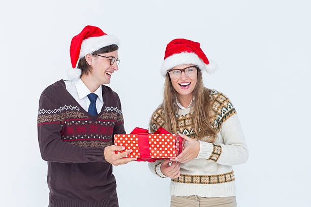 istock Geeky hipster couple holding present 479603784