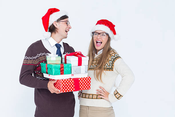 istock Geeky hipster couple holding presents 479603794