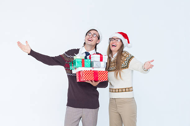 istock Geeky hipster couple holding presents 479603804