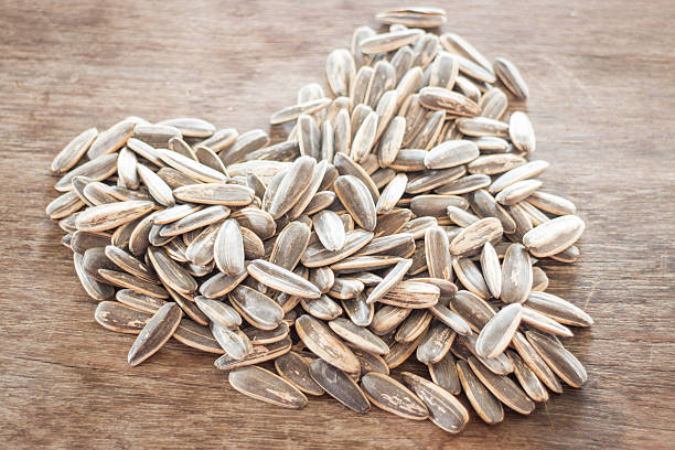 istock Sunflower seeds on weathered wood 479606652