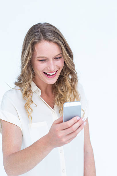 istock Smiling woman texting with her smartphone 479607236