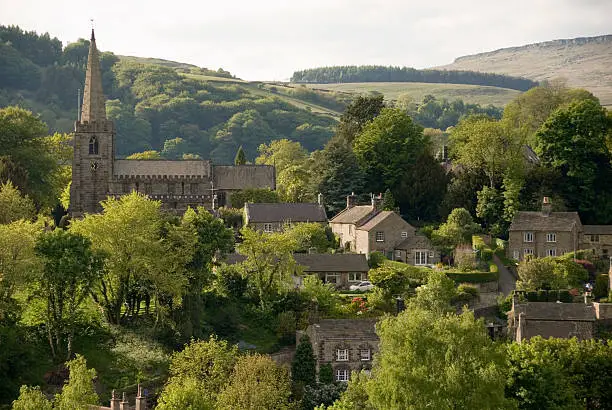 Hathersage village and church nestled in the rolling hillsides of the Peak District, Derbyshire UK