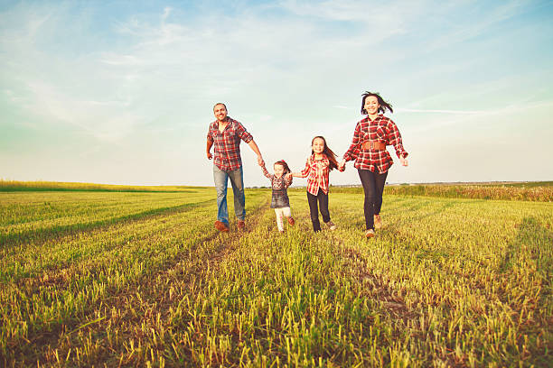 istock family running in the field. 479607914