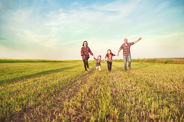 istock family running in the field. 479607964