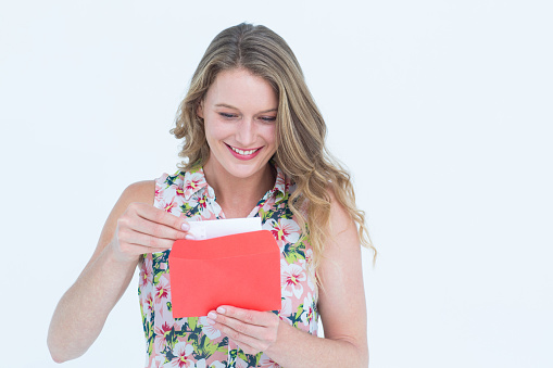 Smiling woman with letter on white background 
