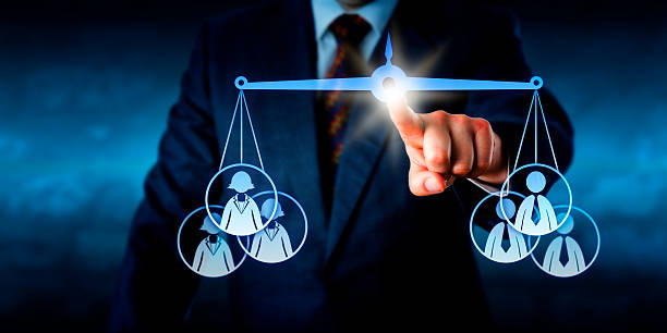 istock Torso Balancing A Female Versus A Male Work Team 479609078
