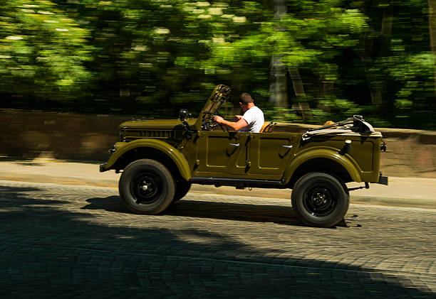 Old retro car GAZ- 69 Lviv, Ukraine - June 13, 2015:Old retro car GAZ- 69 taking participation in race Leopolis grand prix 2015, Ukraine. jeep 4x4 off road vehicle world war ii stock pictures, royalty-free photos & images