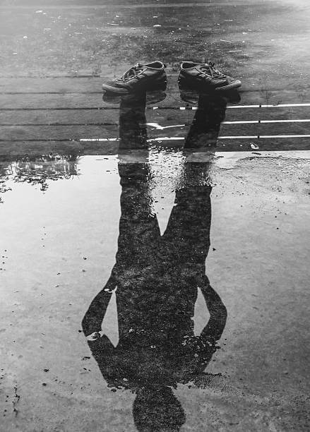 istock The man reflection in the water after raining 479610740