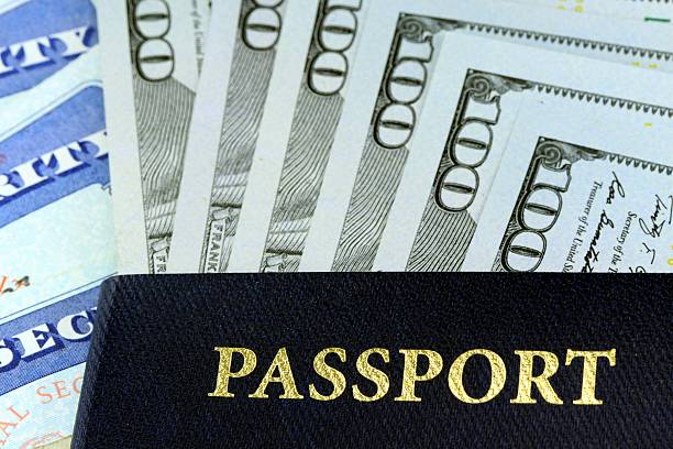 istock Travel Documents - USA Passport with American Currency 479610869
