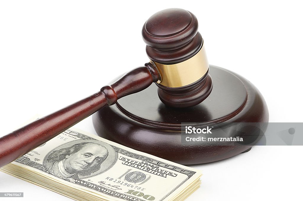 Law gavel on a stack of American money. Auction Stock Photo