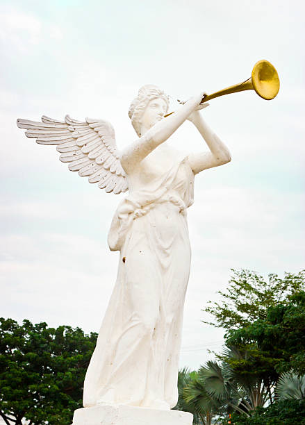 istock angel blowing golden horn 479612209