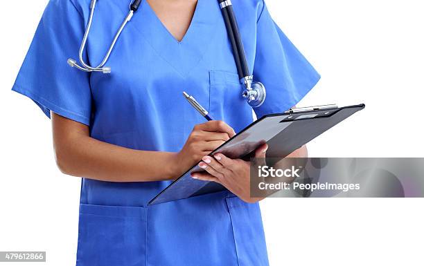Perusing Medical Records Stock Photo - Download Image Now - 2015, Adult, Adults Only