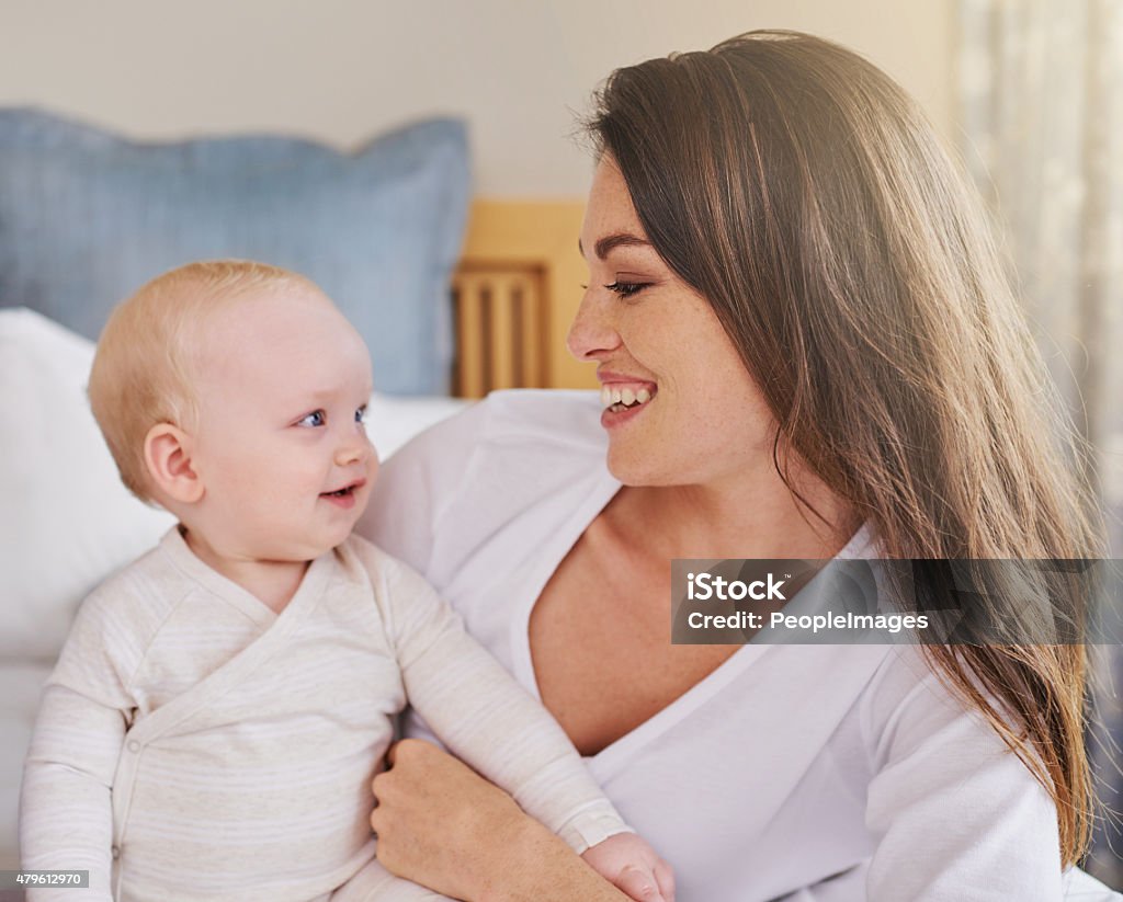 Smiling for mommy Cropped shot of a young mother and her baby daughter in the bedroomhttp://195.154.178.81/DATA/i_collage/pi/shoots/784147.jpg 2-3 Years Stock Photo