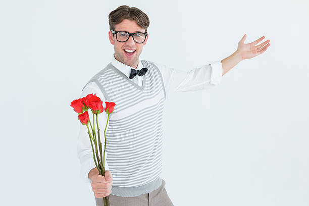 istock Geeky hipster offering bunch of roses 479613598