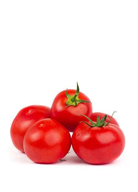 istock Fresh tomatoes with green leaves isolated on white background 479616092