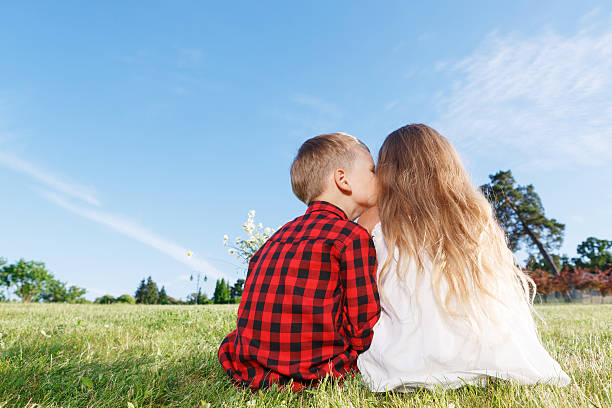 Nice little girl and boy sitting backwards