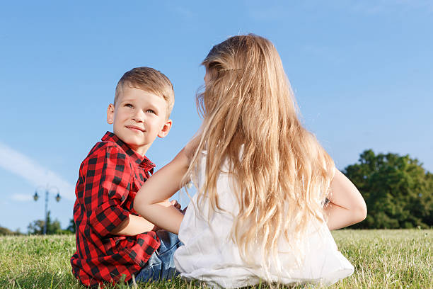 istock Nice little girl and boy sitting backwards 479616492