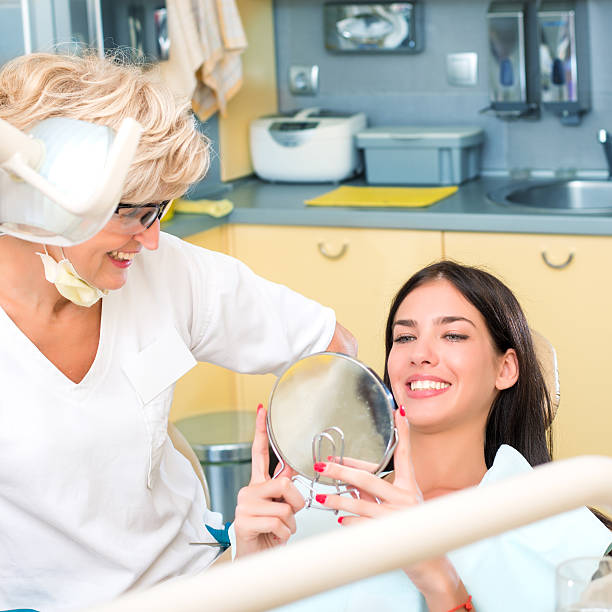 istock Patient at the dentist with mirror 479617926