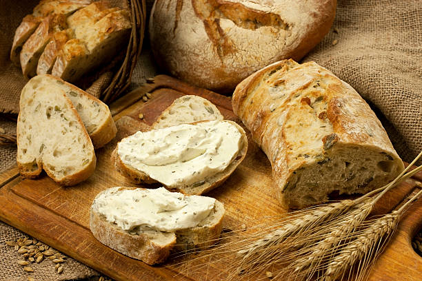 istock Assortment of baked bread on wood table 479620569