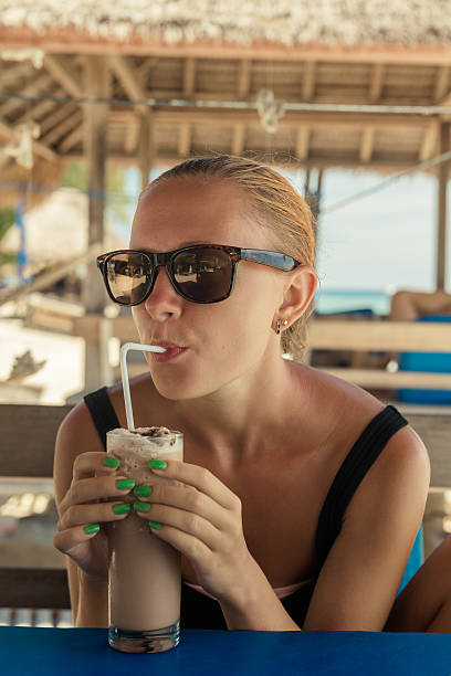 istock Young woman enjoying milkshake 479622269