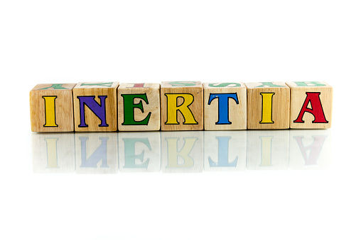 inertia colorful wooden word block on the white background
