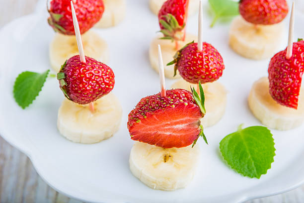 istock Strawberry and banana on a stick 479625902