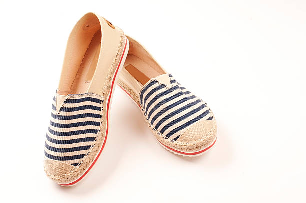istock Pair of beige espadrilles with blue and red pattern 479626616