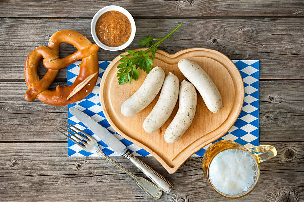 Bavarian white sausage Bavarian meal with white sausage on cutting board weisswurst photos stock pictures, royalty-free photos & images
