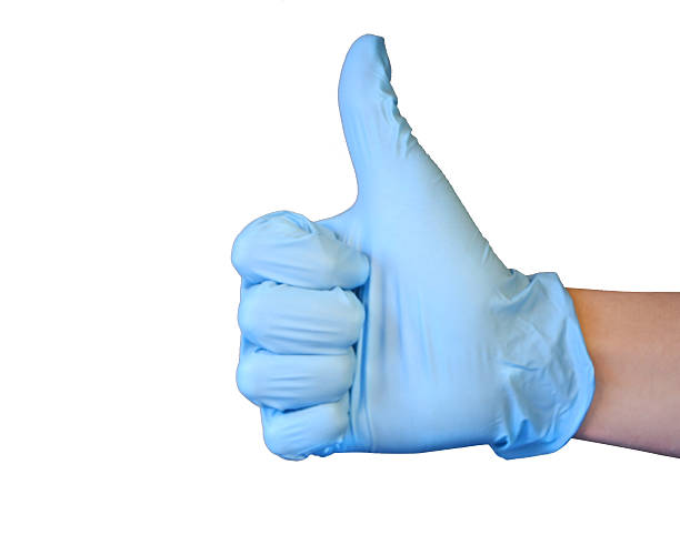 protection de vos mains avec des gants en latex et pouce levé - antibakteriell photos et images de collection