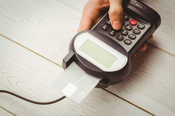istock Man entering his pin on terminal 479630316