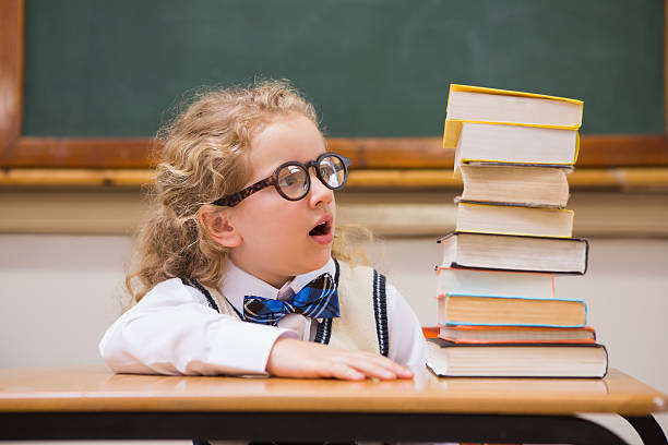istock Surprise pupil looking at books 479631102