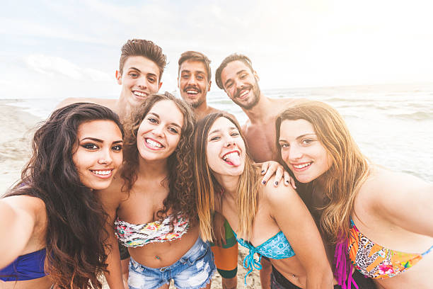 istock Multiracial group of friends taking selfie on the beach 479631346