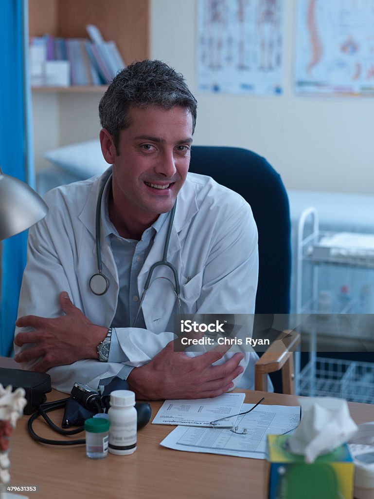 Male doctor sitting on chair  20-29 Years Stock Photo