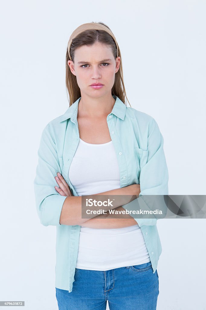 Upset hipster looking at camera Upset hipster looking at camera on white background 18-19 Years Stock Photo