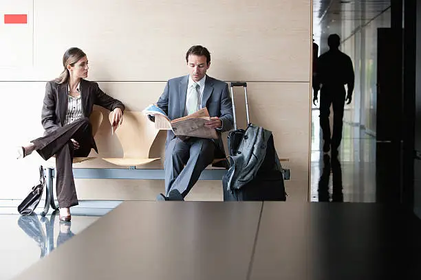 Photo of Business people sitting in waiting area