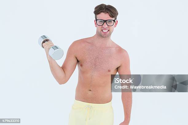 Geeky Hipster Posing Topless With Dumbbell Stock Photo - Download Image Now - 20-24 Years, 20-29 Years, 2015