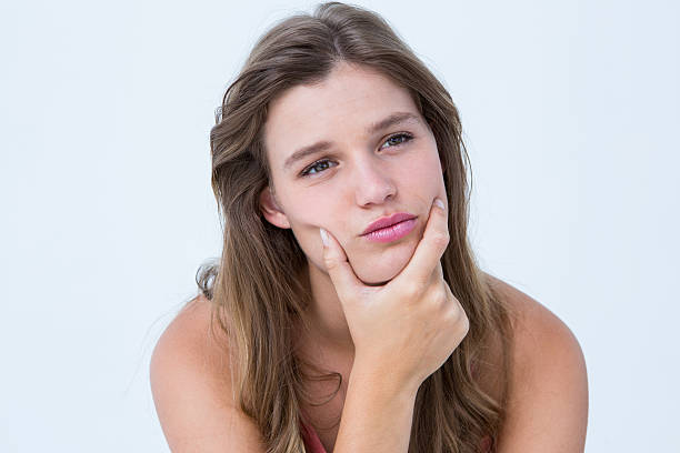 istock Curious woman with hand on jaw 479637976