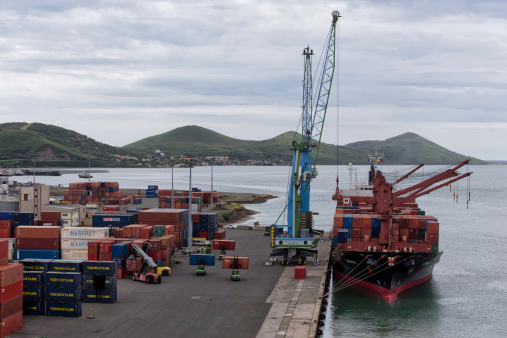 Noumea, New Caledonia - February 15 2014: Cargo ship 'Chenan' is unloaded at the dockside. Noumea is the main port in New Caledonia.