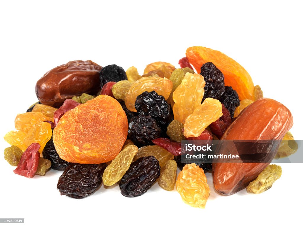 Selection Of Healthy Dried Fruits a DSLR royalty free digital image of a mixed selection of juicy looking dried fruits, including raisins, sultanas, dates, currants, apricots, isolated against a plain white background Dried Fruit Stock Photo