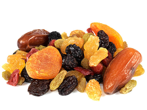 Selection Of Healthy Dried Fruits a DSLR royalty free digital image of a mixed selection of juicy looking dried fruits, including raisins, sultanas, dates, currants, apricots, isolated against a plain white background dried fruit stock pictures, royalty-free photos & images